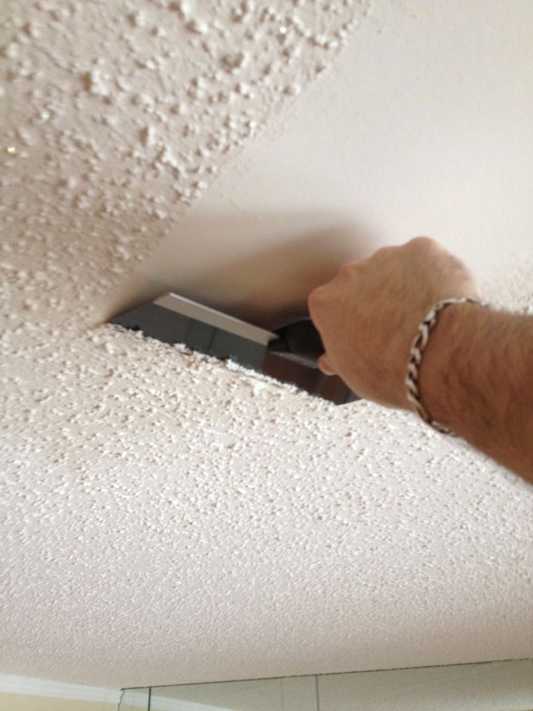 How much does popcorn ceiling removal cost showing scraping process and smooth finished ceiling