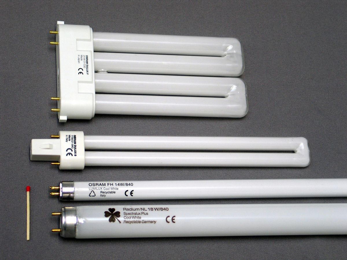 how to recycle fluorescent tube Certified Recycling center staff safely handling fluorescent tube lights and showing how to recycle fluorescent tubes