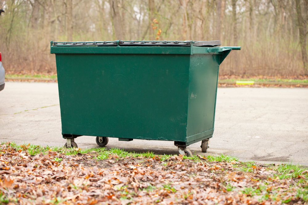 20 yard dumpster rental filled with construction debris on residential driveway