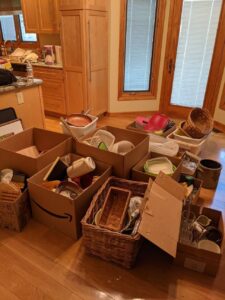 How to get rid of summer junk by sorting outdoor furniture, boxes, and household clutter for donation, recycling, and disposal