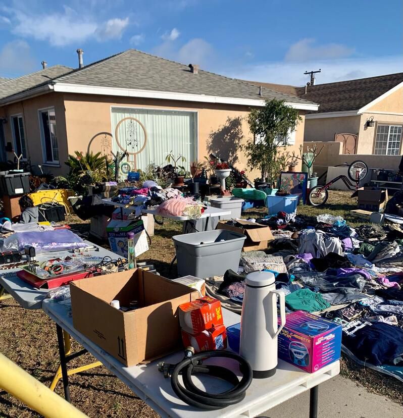 Different types of household waste including recyclables, food waste, furniture, and hazardous materials sorted for proper disposal.